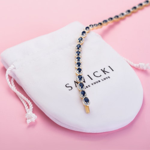 Bransoletka tenisowa SAVICKI: złota, diamenty, niebieskie szafiry